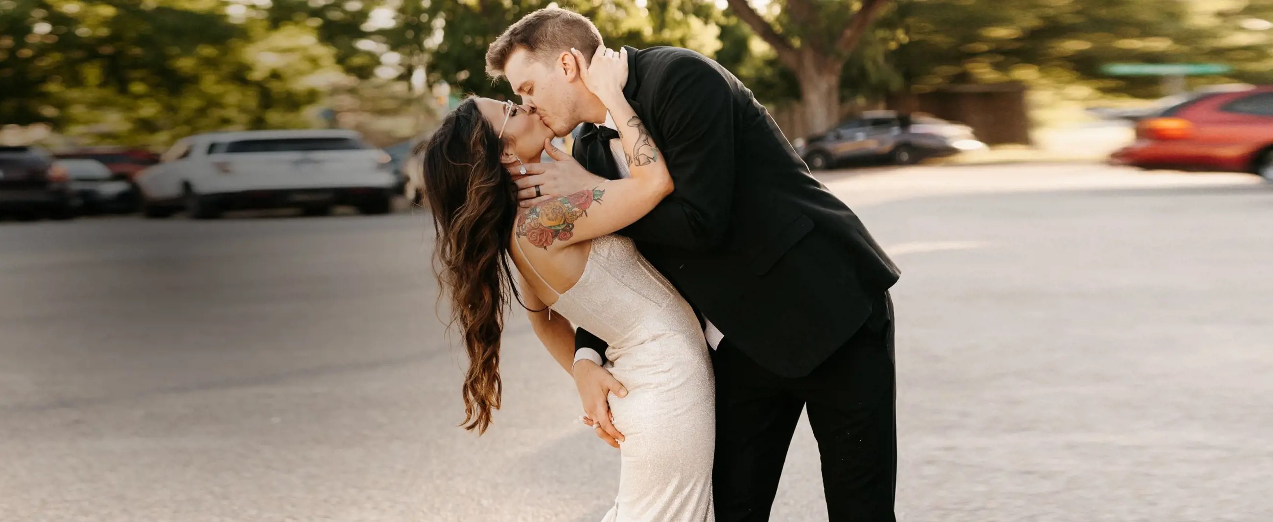 Сouple wearing a white gown and a black suit