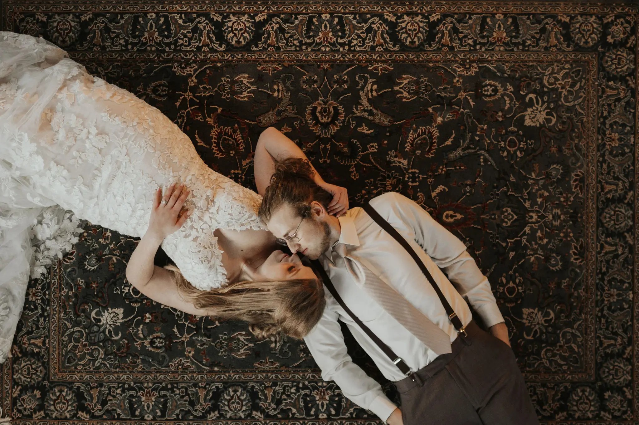 Сouple wearing a white gown and a black suit